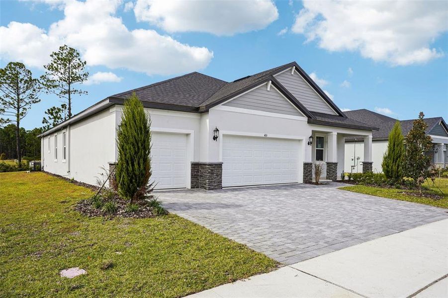 Front exterior of a new home in , Ormond Beach, FL, highlighting curb appeal (Image 21).