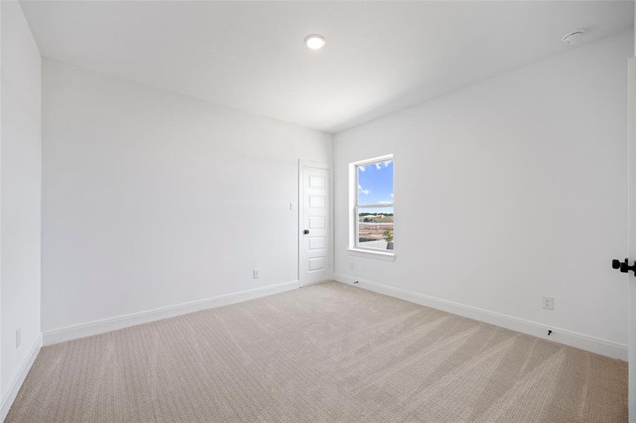 Empty room featuring carpet