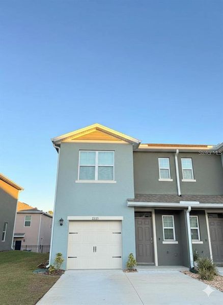 Front exterior of a new home in , Davenport, FL, highlighting curb appeal (Image 16).