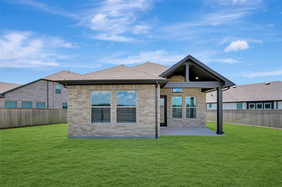 Exterior details and patio area of a home in Prairieland Village - Grove Collection, Cypress (Image 3). Exterior details and patio area of a home in Prairieland Village - Grove Collection, Cypress (Image 3).