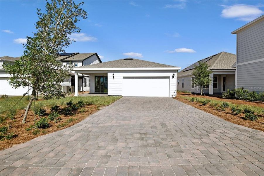 Front exterior of a new home in , St. Cloud, FL, highlighting curb appeal (Image 26).
