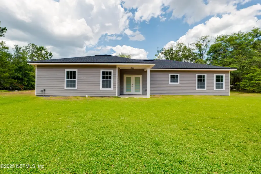 Front exterior of a new home in , Middleburg, FL, highlighting curb appeal (Image 17).