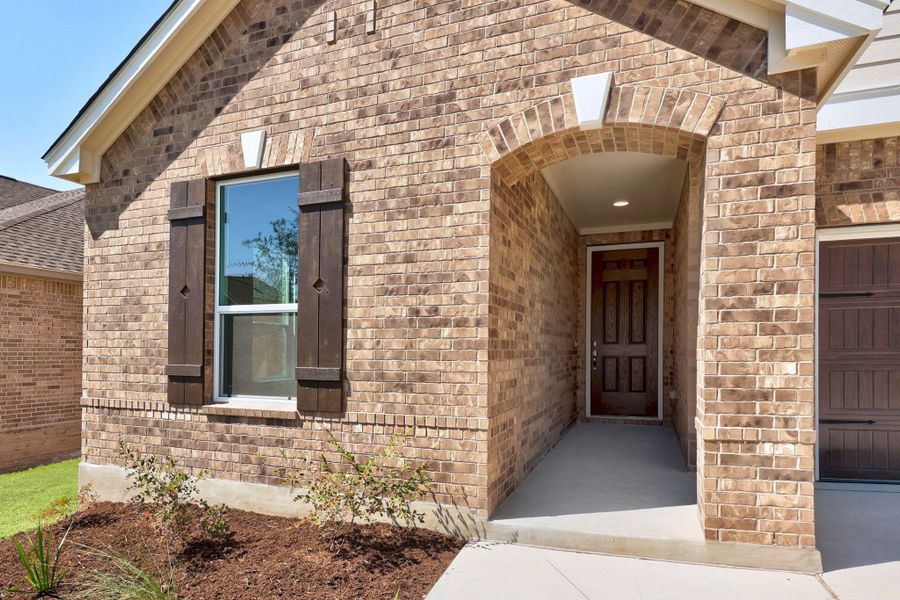 Front exterior of a new home in Salerno - Classic Collection, Round Rock, TX, highlighting curb appeal (Image 2). Front exterior of a new home in Salerno - Classic Collection, Round Rock, TX, highlighting curb appeal (Image 2).