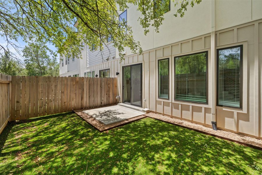 Front exterior of a new home in East Grove Condominiums, Austin, TX, highlighting curb appeal (Image 23). Front exterior of a new home in East Grove Condominiums, Austin, TX, highlighting curb appeal (Image 23).