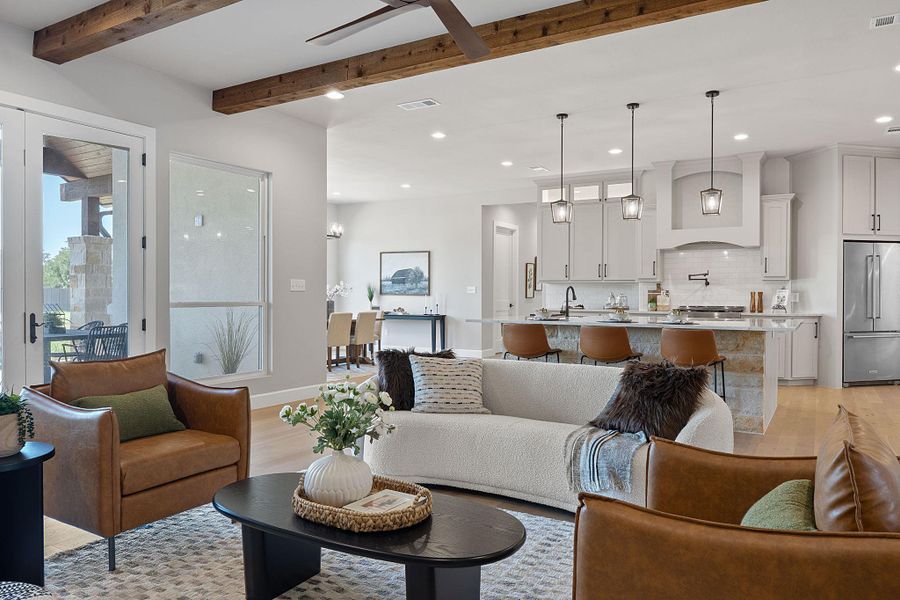 Living area with recessed lighting, light wood-style floors, a ceiling fan, and beamed ceiling