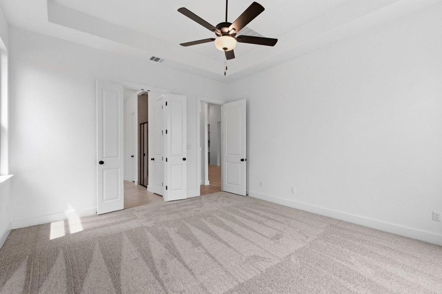 Primary Bedroom with tray ceiling
