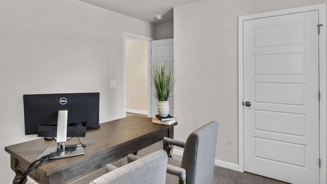 Representative furnished interior of a home built from the Freeport by D.R. Horton in Bailey Park, Fayetteville (Image 6).