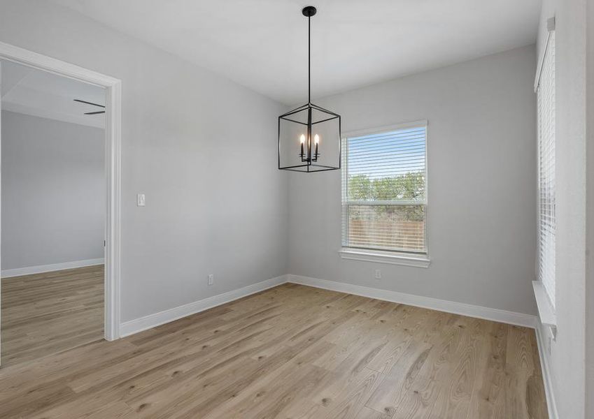 The dining area is located off the kitchen.