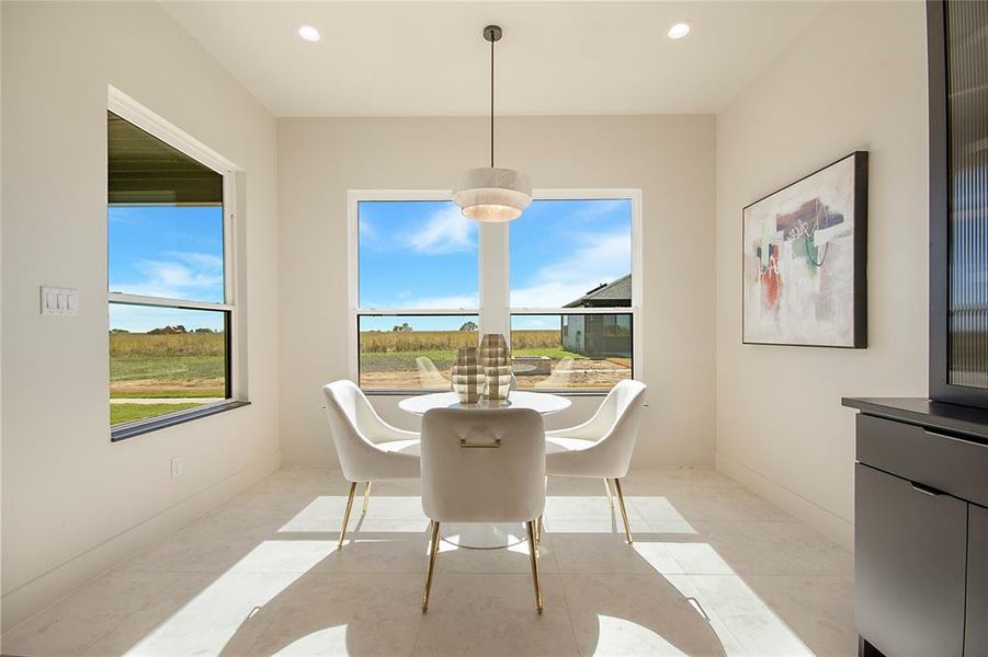 Dining space featuring recessed lighting and light tile patterned flooring Dining space featuring recessed lighting and light tile patterned flooring