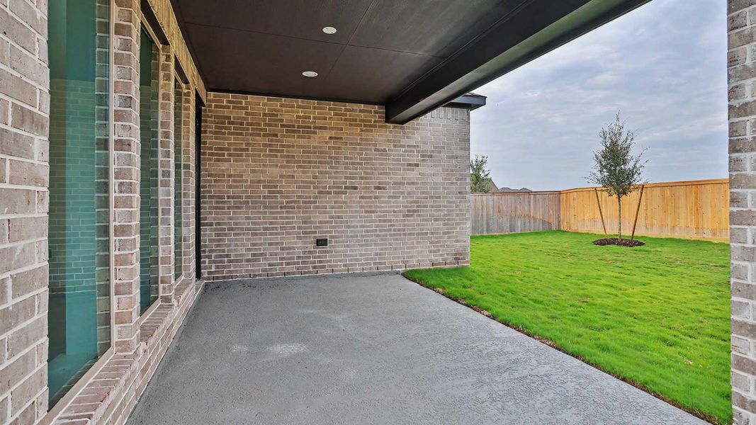 Exterior details and patio area of a home in Bridgeland, Cypress (Image 3).