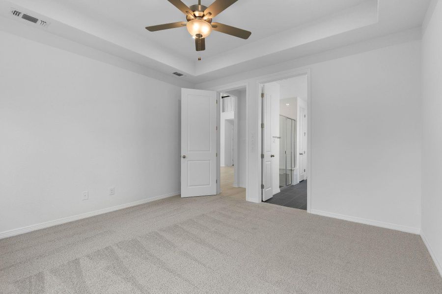 Primary Bedroom with tray ceiling Primary Bedroom with tray ceiling