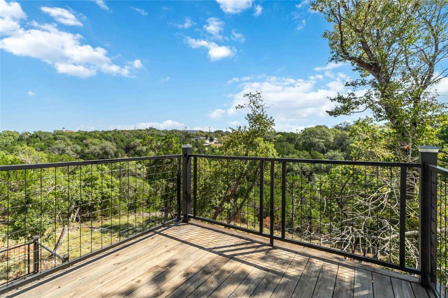 A stunning canyon view unfolds from the upper-level balcony, offering a serene and scenic backdrop. A stunning canyon view unfolds from the upper-level balcony, offering a serene and scenic backdrop.