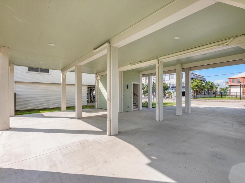 Here's another view of the oversized carport, offering plenty of space for multiple cars and serving as an additional area for entertaining. Its versatility makes it perfect for both parking Here's another view of the oversized carport, offering plenty of space for multiple cars and serving as an additional area for entertaining. Its versatility makes it perfect for both parking