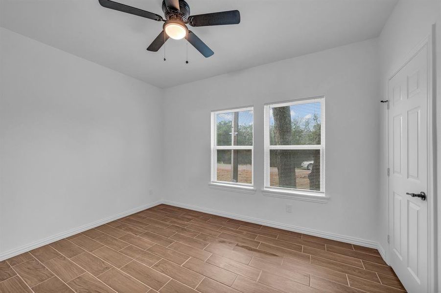 Unfurnished room featuring ceiling fan