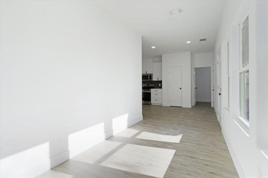 Corridor featuring light hardwood / wood-style flooring