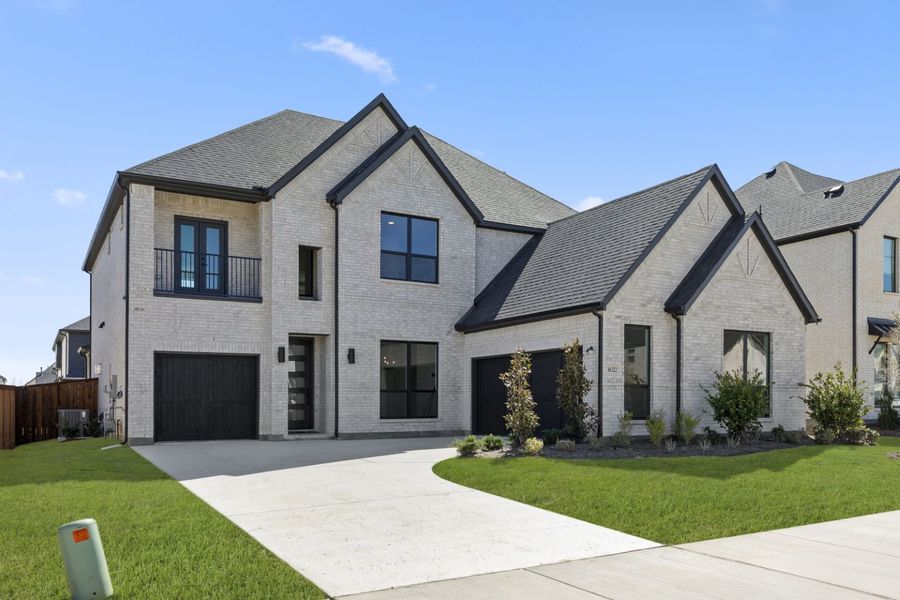 Front exterior of a new home in Estates at Rockhill, Frisco, TX, highlighting curb appeal (Image 2).