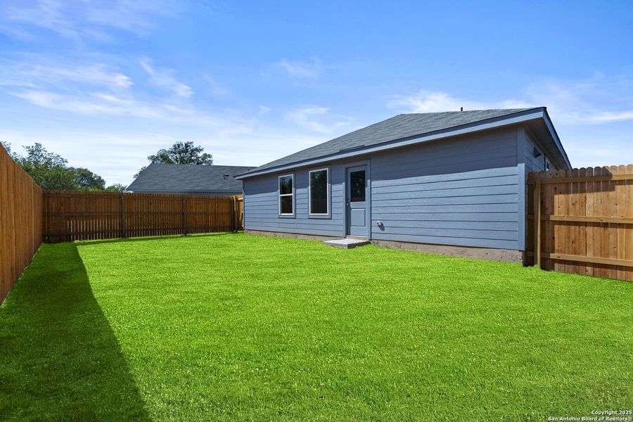Exterior details and patio area of a home in Torian Village: Watermill Collection, San Antonio (Image 1).