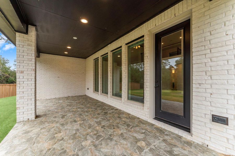 Exterior details and patio area of a home in , Magnolia (Image 24). Exterior details and patio area of a home in , Magnolia (Image 24).