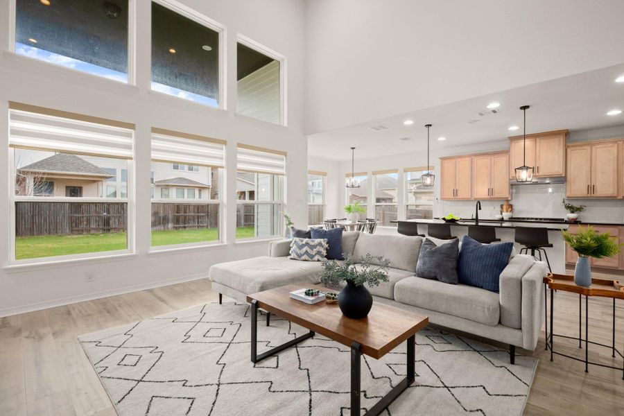 A wall of stacked windows infuses the main living area and second floor in natural light framing peaceful views of your private backyard. A wall of stacked windows infuses the main living area and second floor in natural light framing peaceful views of your private backyard.