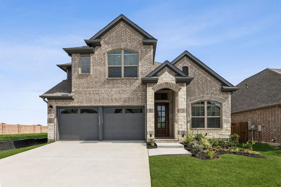 Front exterior of a new home in Avondale, Fate, TX, highlighting curb appeal (Image 1).