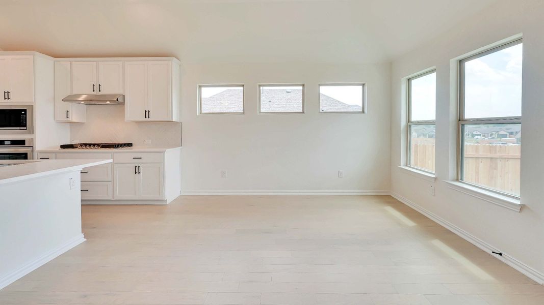 Representative furnished interior of a home built from the Palm by Brightland Homes in Sunterra, Katy (Image 7).