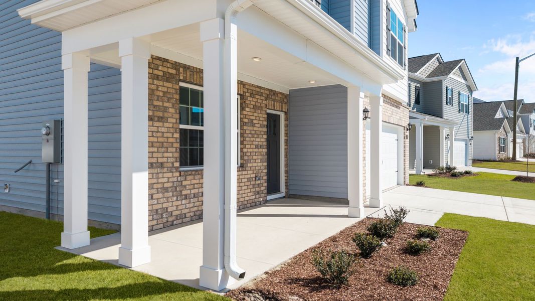 Exterior details and patio area of a home in Ridgewood Farms, Winterville (Image 4).