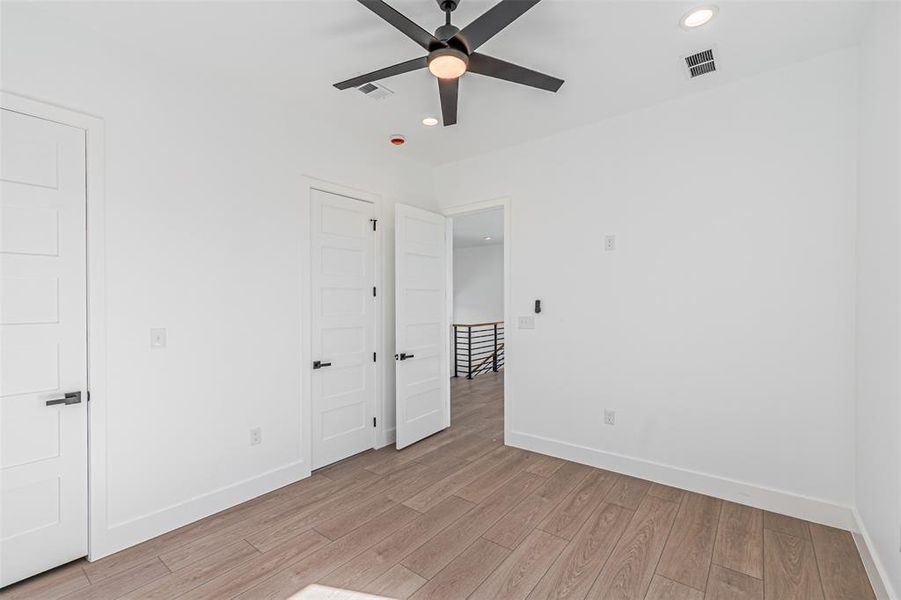 Unfurnished bedroom with recessed lighting, light wood-style flooring, and ceiling fan