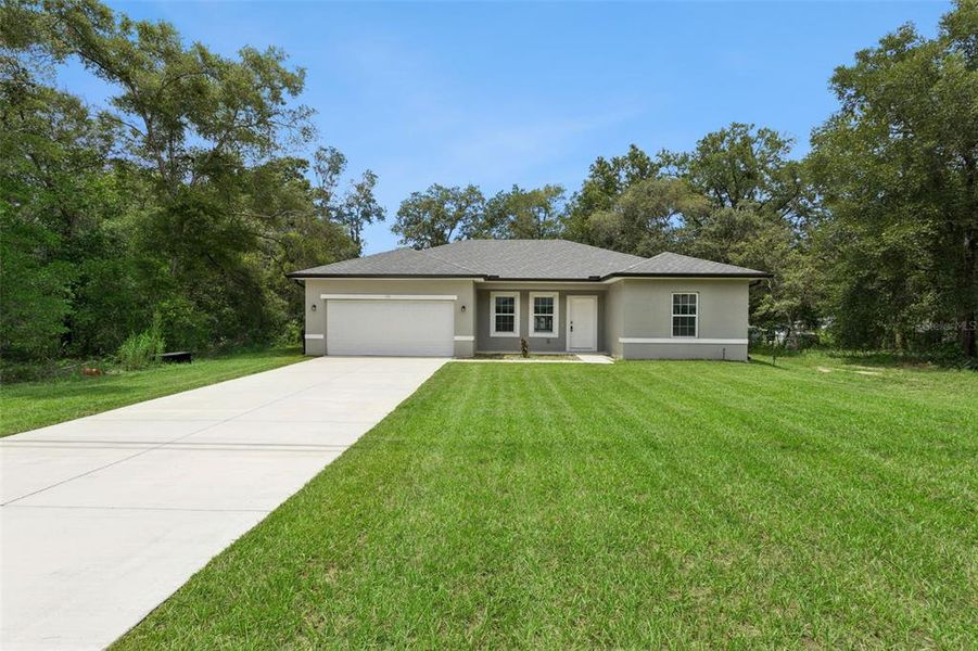 Front exterior of a new home in , Citrus Springs, FL, highlighting curb appeal (Image 2). Front exterior of a new home in , Citrus Springs, FL, highlighting curb appeal (Image 2).
