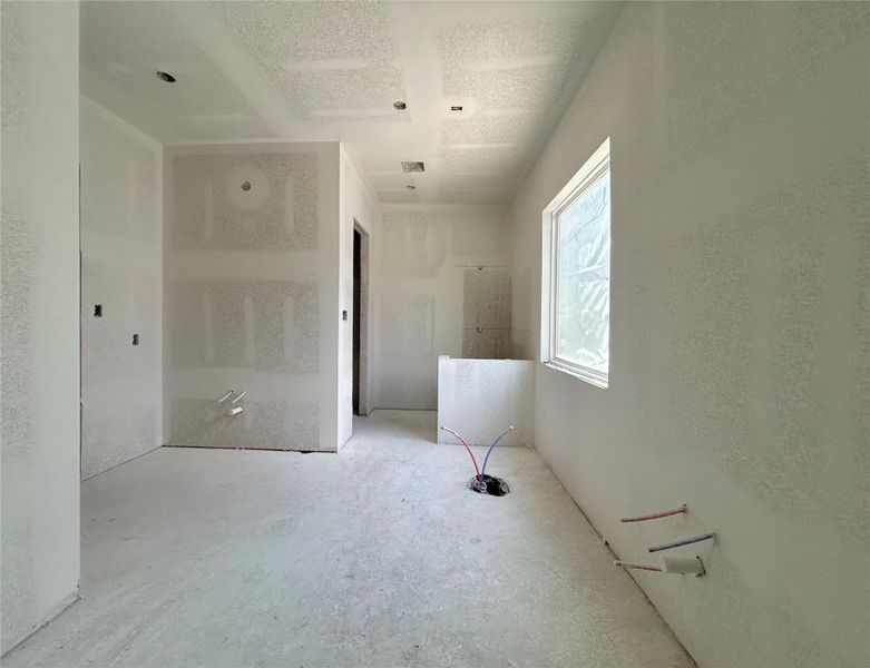 Primary Bathroom to Feature Dual Vanities, a Separate Shower, and a Freestanding Soaking Tub. Construction Photo as of  5/20/2026