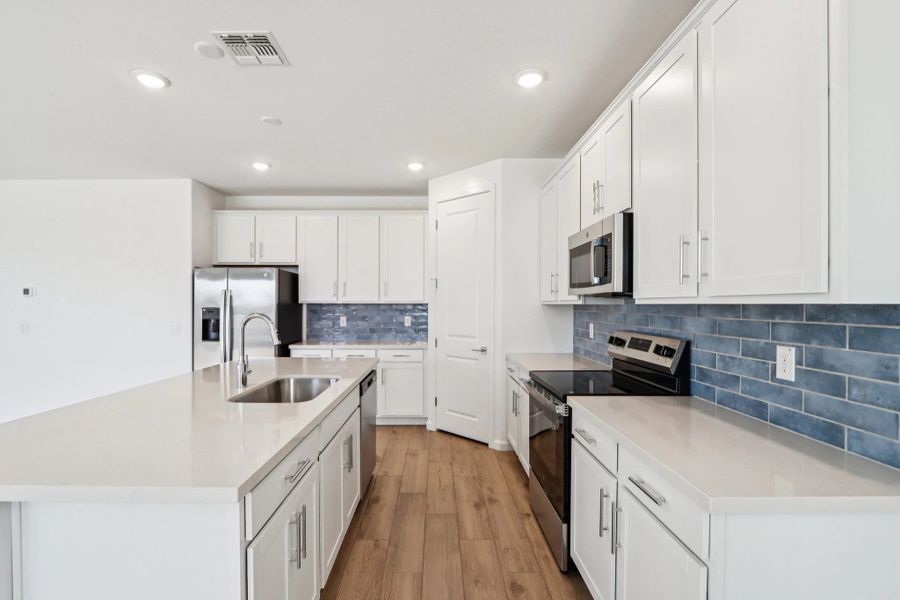 Kitchen featuring the Coastal Collection. Kitchen featuring the Coastal Collection. Representative images and renderings are for illustrative purposes. Actual structural options and design finishes of home may vary.