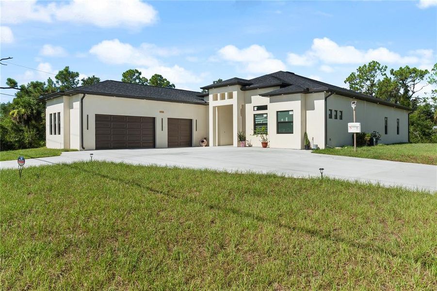 Front exterior of a new home in , Port Charlotte, FL, highlighting curb appeal (Image 2).