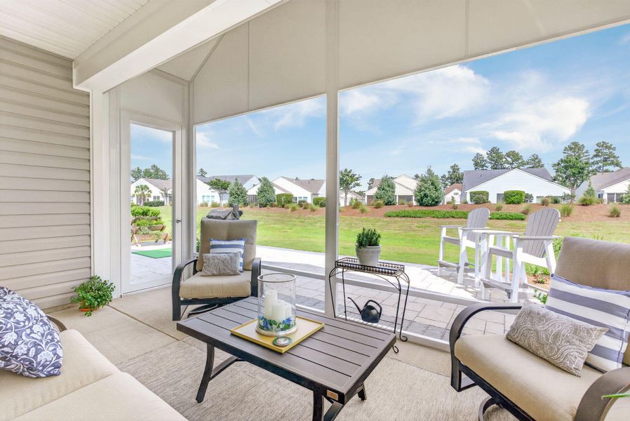 Exterior details and patio area of a home in K. Hovnanian's® Four Seasons at Lakes of Cane Bay, Summerville (Image 24).