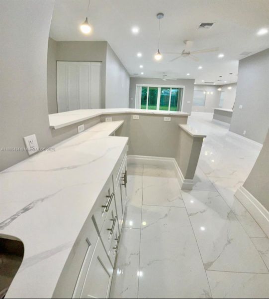 Furnished interior view inside a new home in , Port St. Lucie (Image 6).