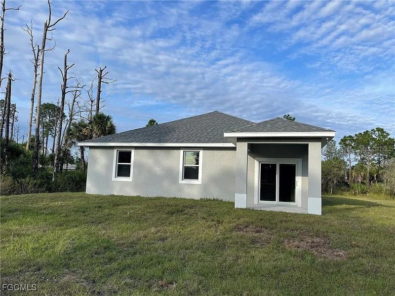 Front exterior of a new home in , Port Charlotte, FL, highlighting curb appeal (Image 2). Front exterior of a new home in , Port Charlotte, FL, highlighting curb appeal (Image 2).