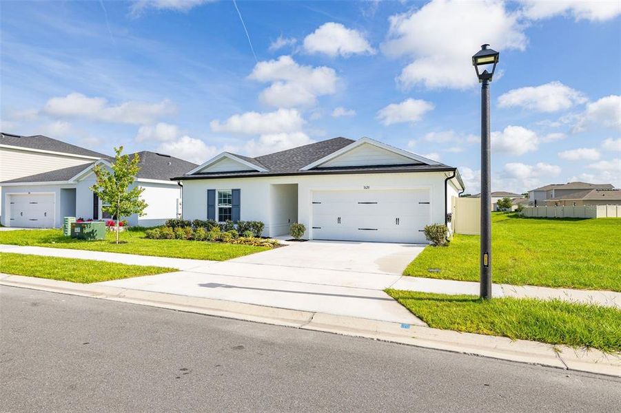 Front exterior of a new home in , Sumterville, FL, highlighting curb appeal (Image 24).