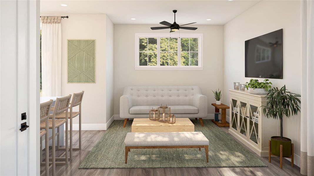 Sitting room featuring wood finished floors, recessed lighting, and ceiling fan Sitting room featuring wood finished floors, recessed lighting, and ceiling fan