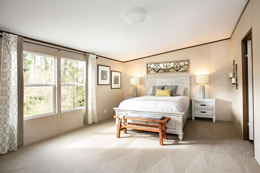 Bedroom with carpet and lofted ceiling