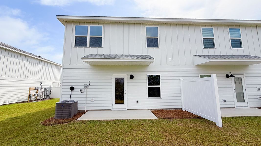 Exterior details and patio area of a home in Salt Creek Townhomes at Mexico Beach, Mexico Beach (Image 4).