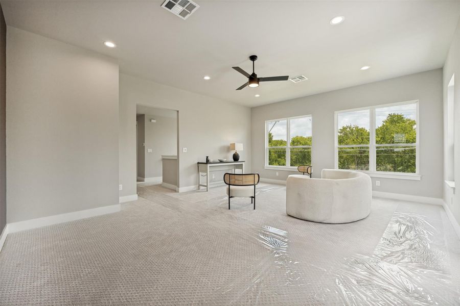 A naturally illuminated loft awaits, featuring ample space and verdant outdoor views. A naturally illuminated loft awaits, featuring ample space and verdant outdoor views.