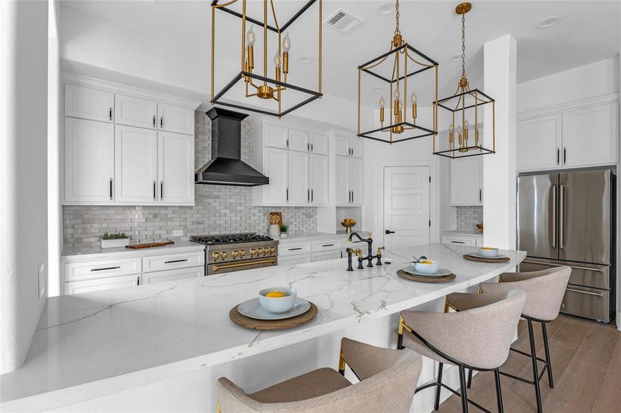 Stunning kitchen with quartz countertops, 11 ft island, & designer finishes Stunning kitchen with quartz countertops, 11 ft island, & designer finishes