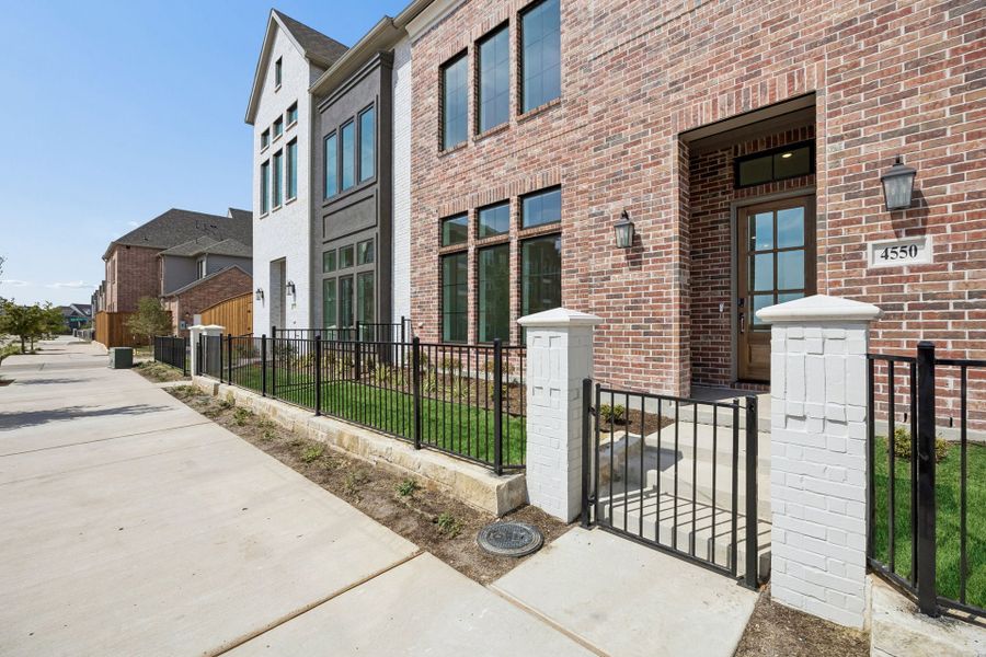 Exterior details and patio area of a home in Newman Village Townhomes, Frisco (Image 22).