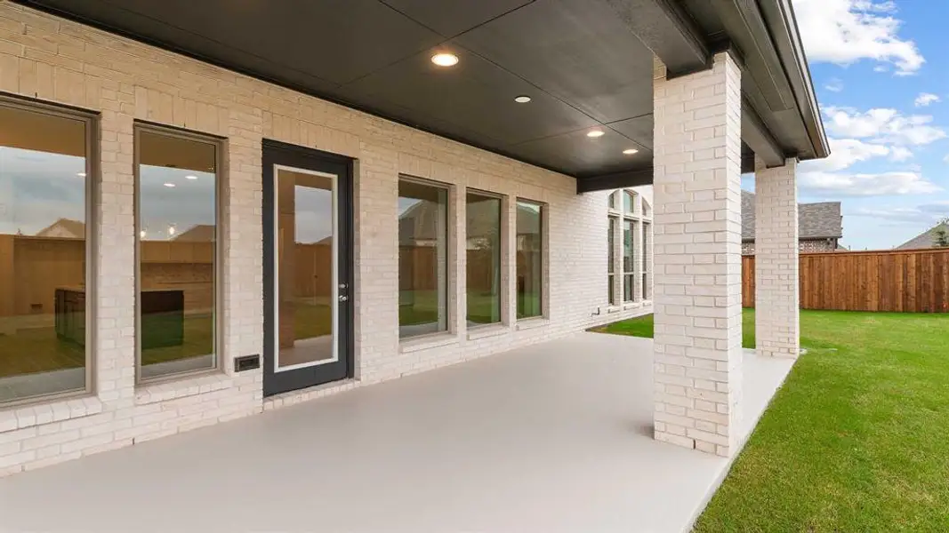 Exterior details and patio area of a home in Myrtle Creek 60', Waxahachie (Image 2).