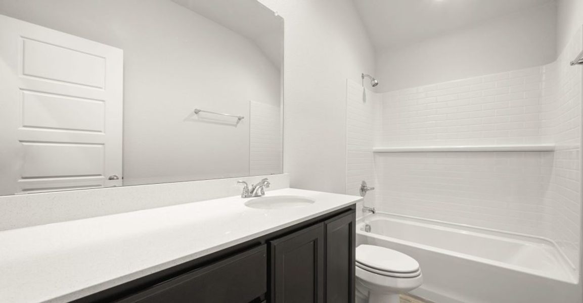 Representative exterior photo of a completed home built from the Boston by Impression Homes in Baker Farms, Cleburne, TX (Image 16).