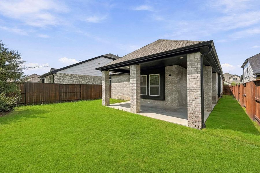 Exterior details and patio area of a home in Meridiana, Iowa Colony (Image 21).