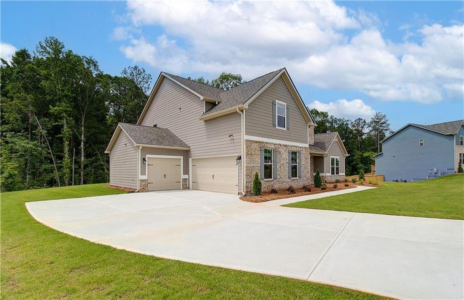 Front exterior of a new home in , Senoia, GA, highlighting curb appeal (Image 2). Front exterior of a new home in , Senoia, GA, highlighting curb appeal (Image 2).