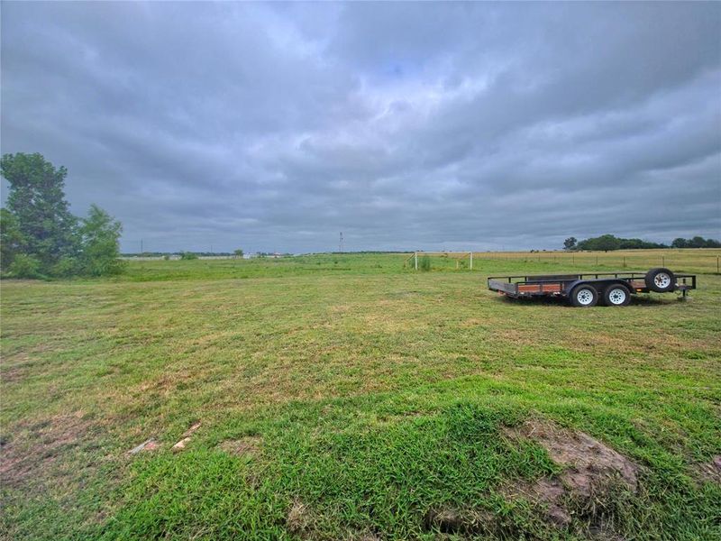 View of green lawn featuring a rural view