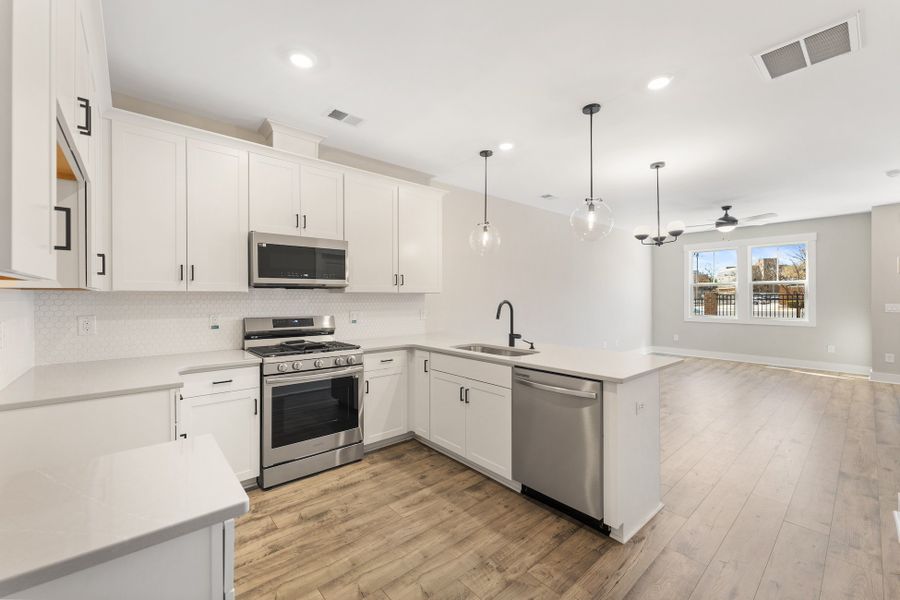 Representative furnished interior of a home built from the Holland by Hunter Quinn Homes in Renaissance Place, Greenville (Image 14).