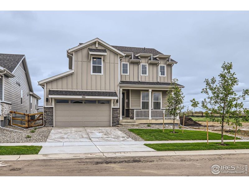 Front exterior of a new home in Barefoot Lakes, Longmont, CO, highlighting curb appeal (Image 1). Front exterior of a new home in Barefoot Lakes, Longmont, CO, highlighting curb appeal (Image 1).