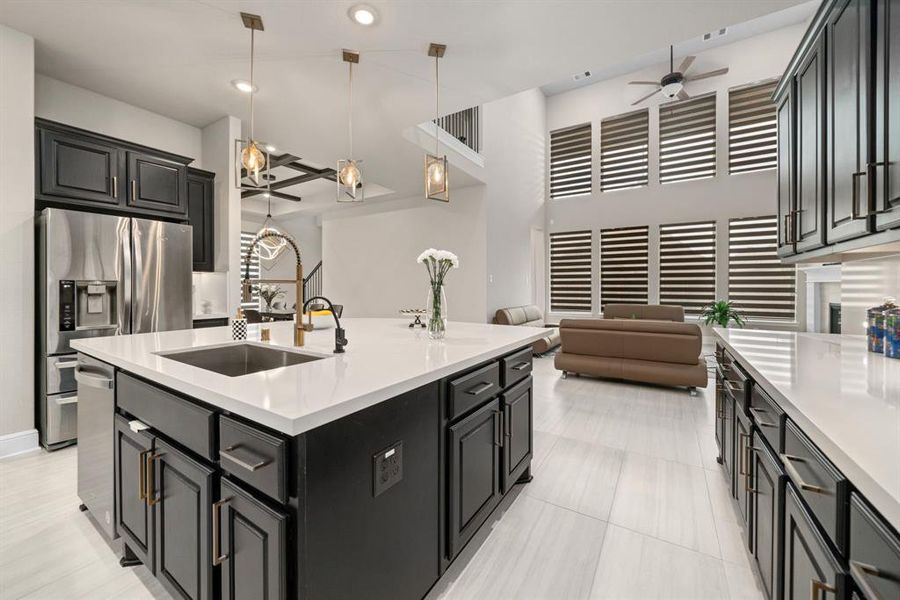 Kitchen looking into open layout family room