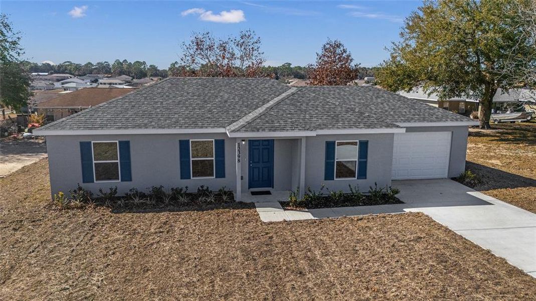 Front exterior of a new home in , Belleview, FL, highlighting curb appeal (Image 21).